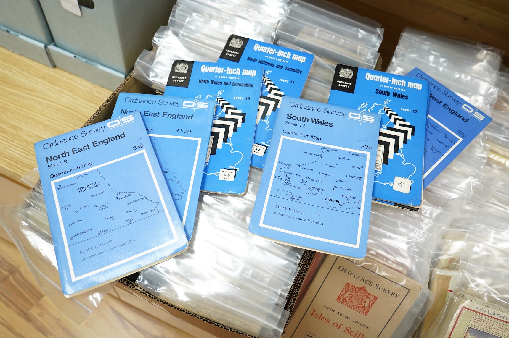 A collection of Ordnance Survey maps including Explorer series 1:25,000, Seventh Series One Inch, together with miscellaneous touring and historic editions (3 boxes)